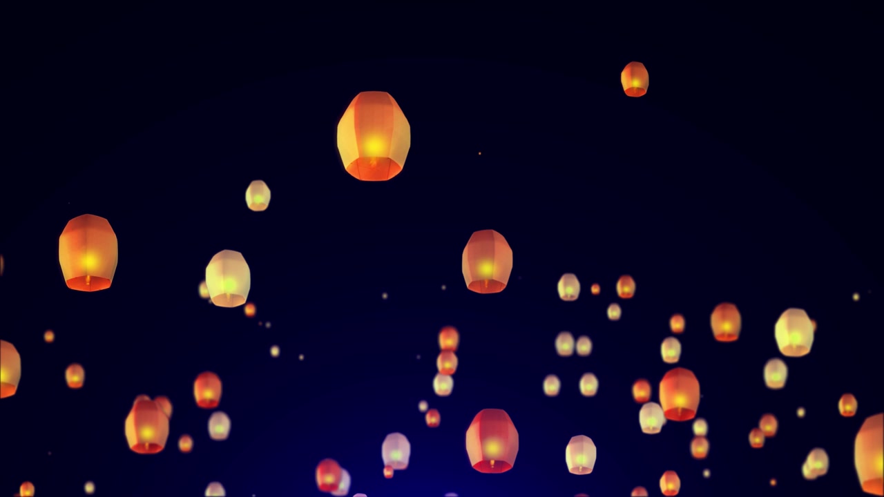 Des lanternes flottantes sont lancées dans le ciel pendant le réveillon du Nouvel An et le festival des lanternes Yee Peng