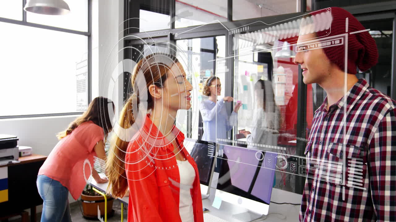 Coworkers collaborating in tech office with sticky notes and floating digital interface overlays