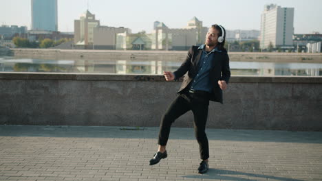 happy man dancing in the city