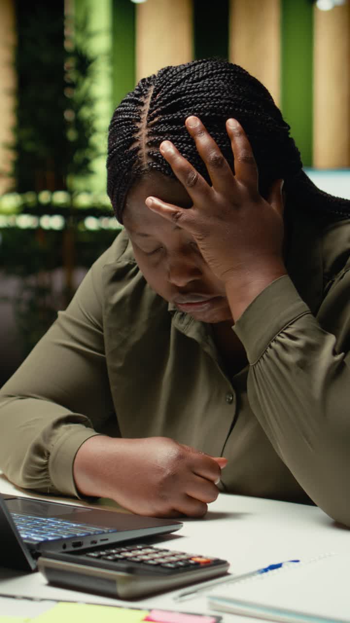 Vertical Video Anxious female consultant struggling to stay awake and overcome tension