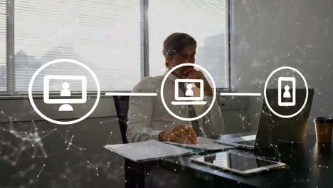Animation of icons and data processing over caucasian businessman in office