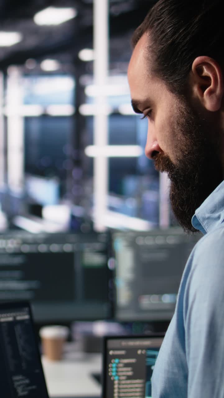 Vertical video Data center programmer using laptop to monitor neural network using AI chatbot