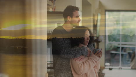 embracing couple at home with sunset animation overlay in background