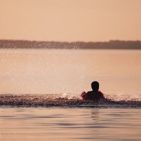 boy having fun in water