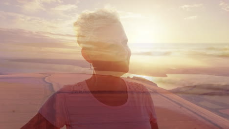 composite of happy senior caucasian woman stretching on beach, and sunset over lake