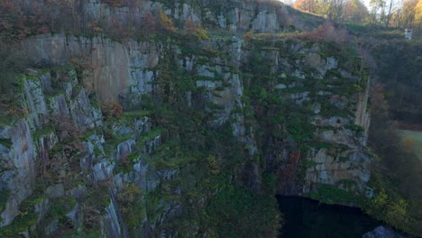 Plants-Growing-On-The-Stepped-Walls-Of-Wiener-Graben-Granite-Quarry-In-Mauthausen-Memorial,-Upper-Austria