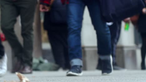 Blurry image of people walking on a city street