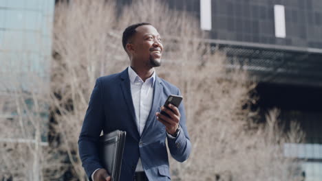 Businessman-reading-good-news-on-phone