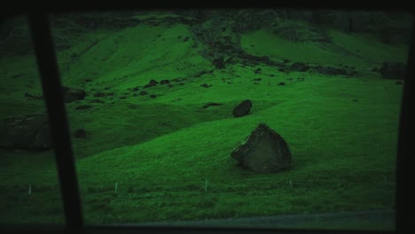 Shot-of-grassy-landscape-from-the-backseat-of-the-car