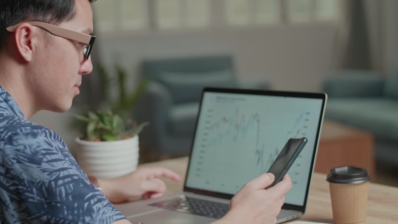 Business Man Talking On Phone During Work With Laptop Computer At Home, Video In 4K