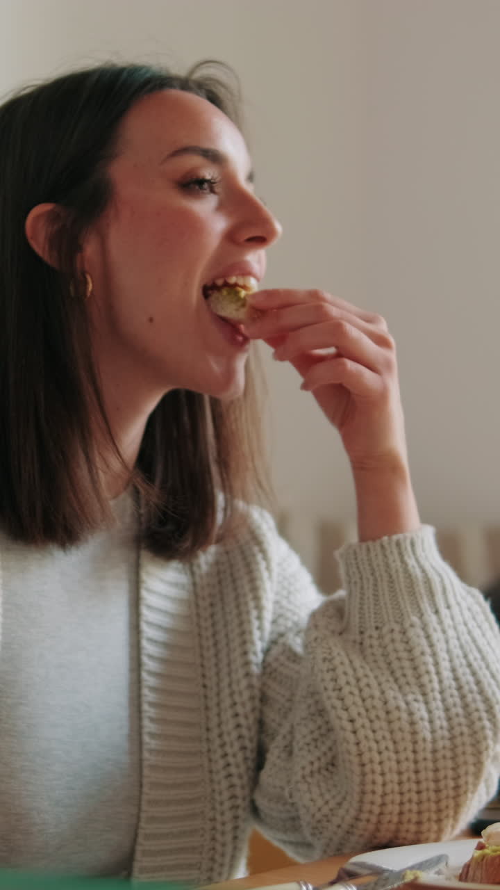Young Woman Eating a Healthy Snack Indoors