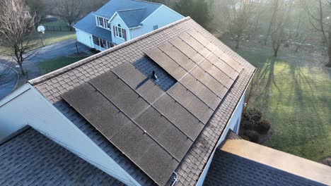 Aerial-of-solar-panels-covered-in-ice-and-frost-in-winter-cold