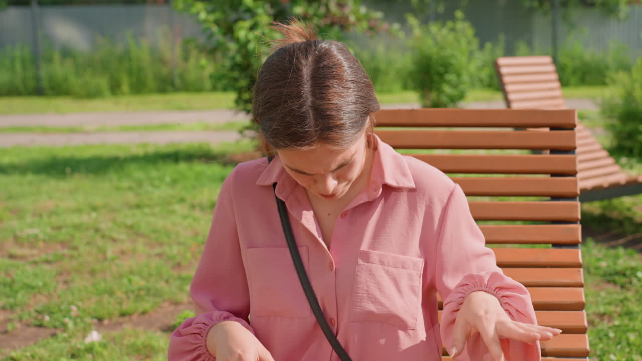 Woman Rubbing Small Puppy, Lady Cuddles Playful Fluffy Canine Outdoors, Park Scene With Woman And Adorable Puppy Interaction, Summer Day In Park Shows Woman Gently Stroking Lively Small Dog