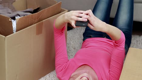 smiling blonde using smartphone