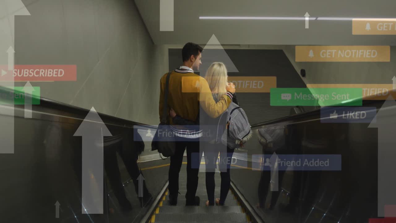 Animation of social media icons floating over caucasian couple embracing on moving stairs