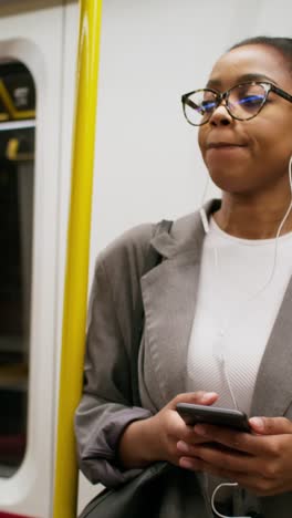 woman on subway listening to music