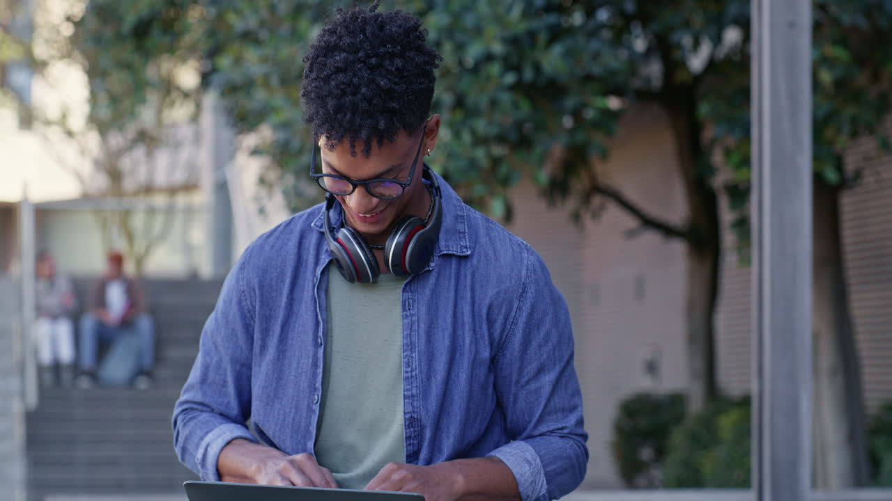 Portrait of a Smiling Student with Headphones