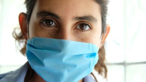 Close-up-portrait-of-female-doctor-with-medical-face-mask