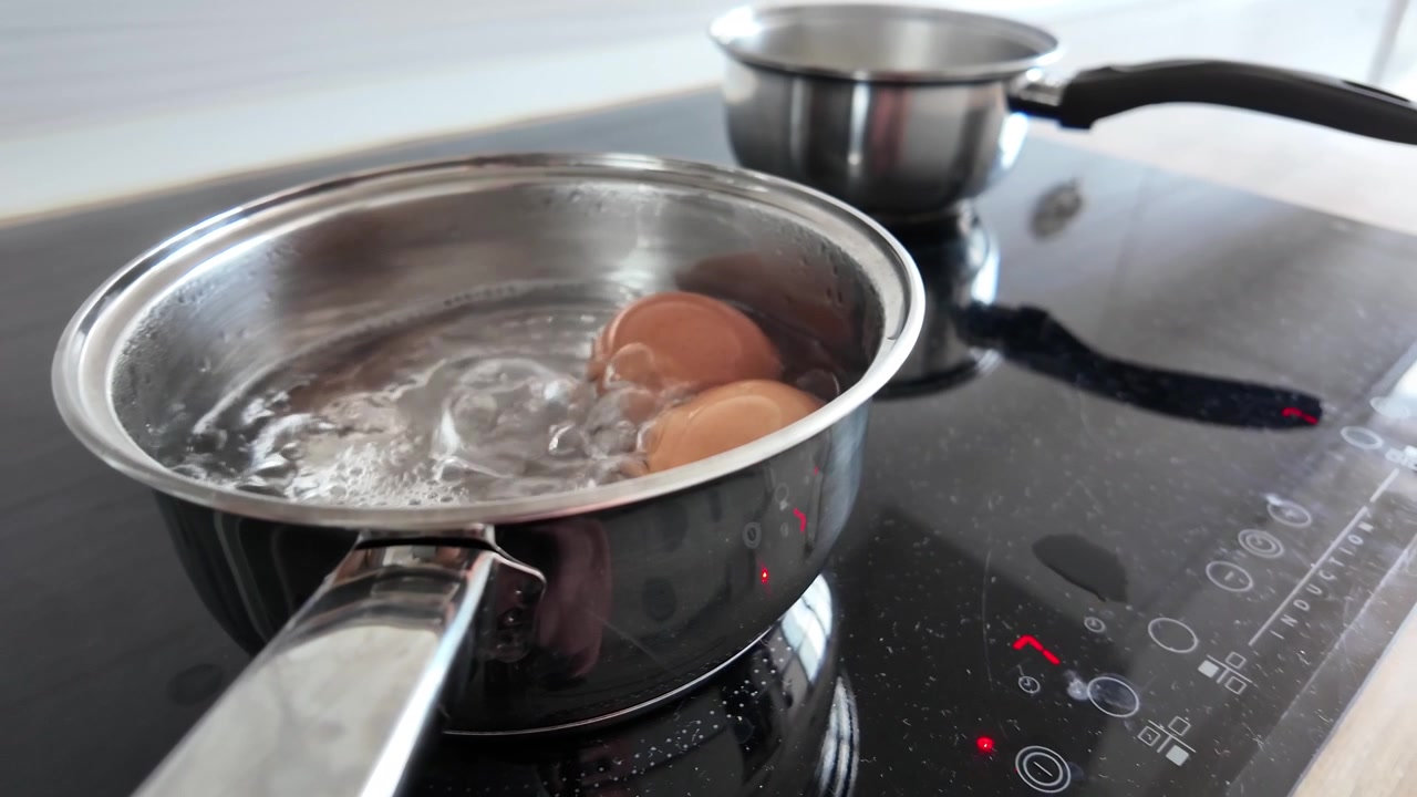 Eggs Boiling in Saucepan in Slow Motion