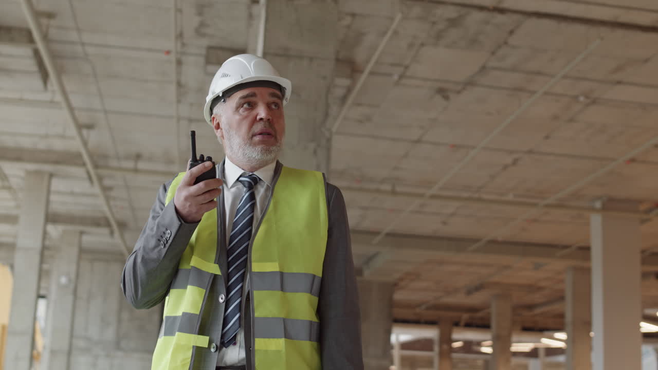 Foreman Using Walkie-Talkie