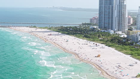 south beach miami, florida usa, aerial view of people on sandy shore and beachfront buildings