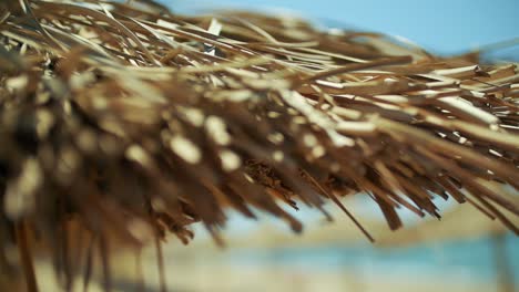 close-up of a straw beach umbrella