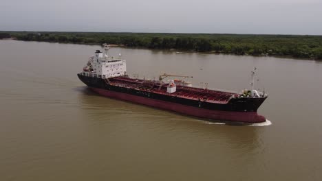 Drone-shot-of-Big-Oil-products-tanker-ship-sailing-on-river-in-Argentina