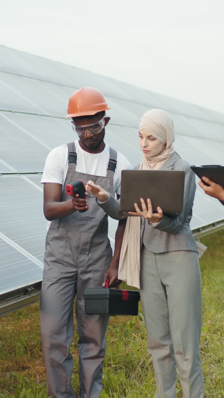 Solar panel technician inspecting