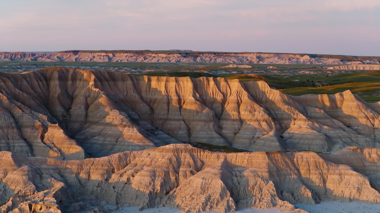 Badlands Landscape at Golden Hour Painted by Warm Sunset Colors