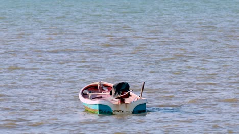 small fishing boat on calm water