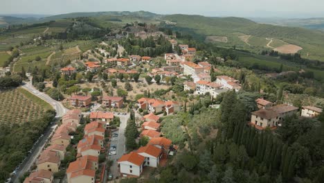 drone shot overlooking a small town in tuscany