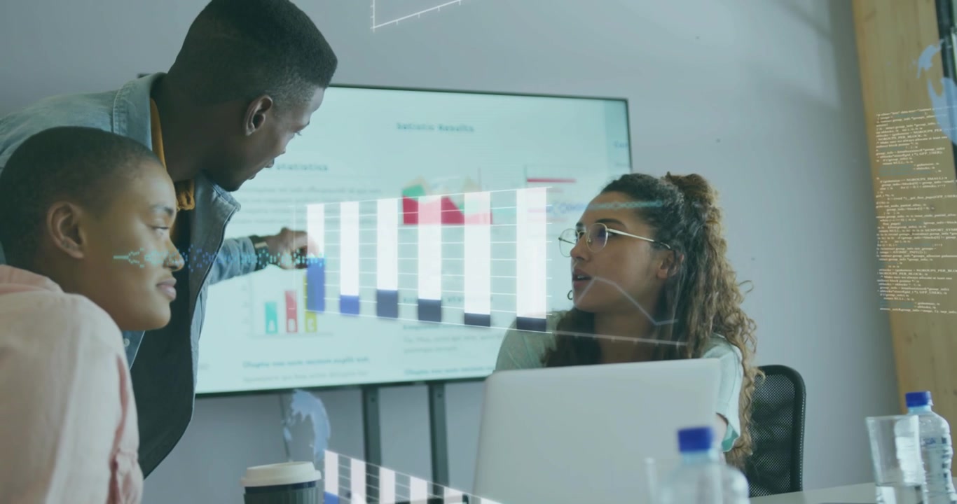 Women reviewing business data on laptop man entering carrying cup explaining fading charts on glass