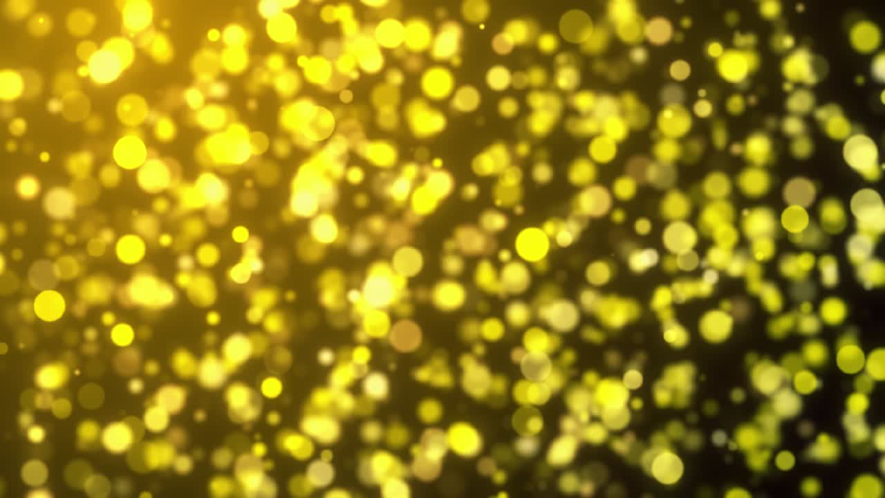 Abstrakte gyldne bokeh-partikler, der svæver problemfrit