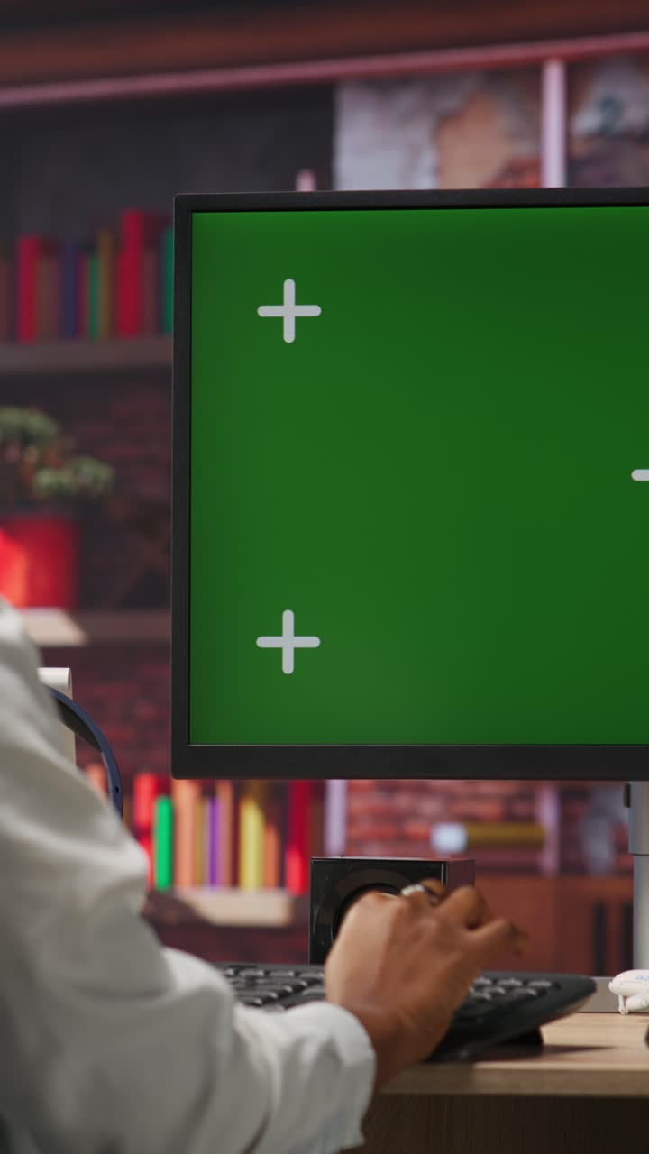 Vertical video Student at home browsing internet on green screen computer
