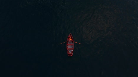 top down view of a red paddle of centered in the frame