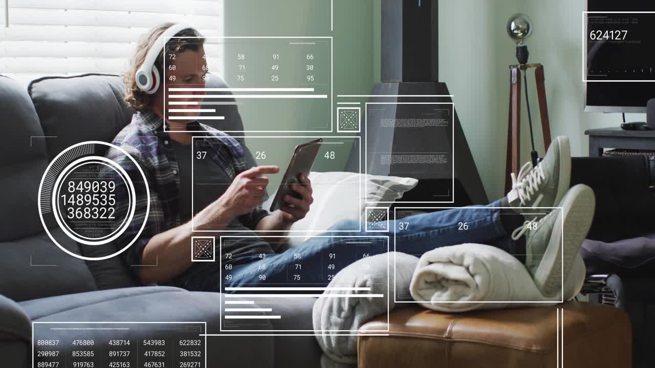 Man on sofa, tapping device spawning HUD overlays around hands, growing denser for tech