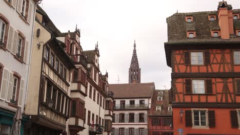 view of strasbourg cathedral above classic colorful alsace architecture festive christmas market in strasbourg, france europe