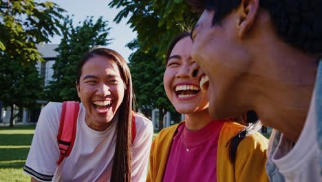 happy students laughing outdoors