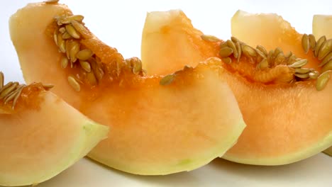 exotic melon fruit close-up. sliced melon on a white background