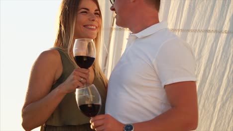 couple enjoying wine on a yacht