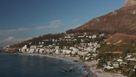 Cape-Town,-South-Africa---The-Clifton-Beach-Suburb-with-Lion's-Head-in-the-Backdrop---Aerial-Drone-Shot