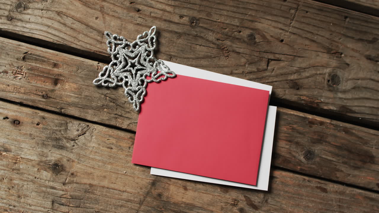 Video of christmas decorations with cards and copy space on wooden background