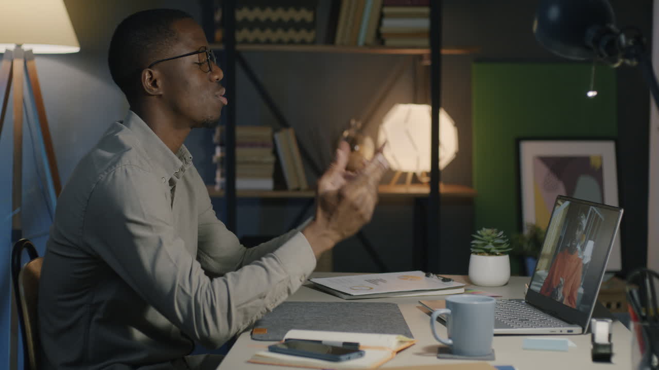 Man in video call at home office
