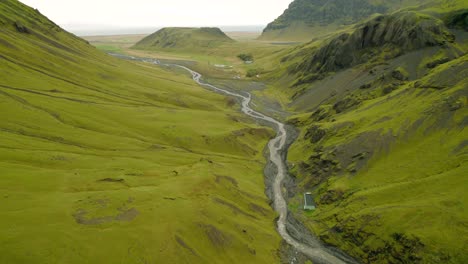 icelandic seljavallalaug old thermal hot tub in green valley