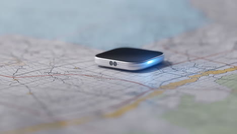 modern navigation device on a paper map