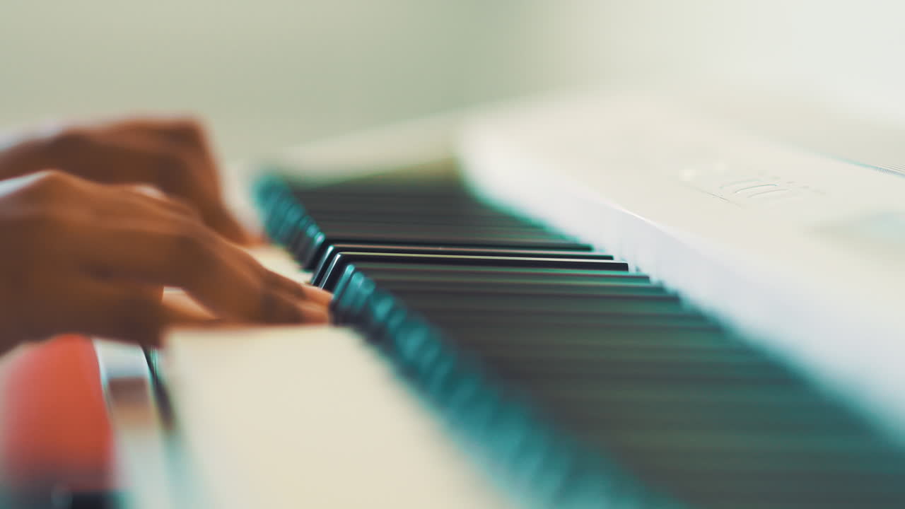 Young girl playing a white piano