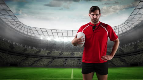 un giocatore di rugby professionista in piedi davanti a uno stadio