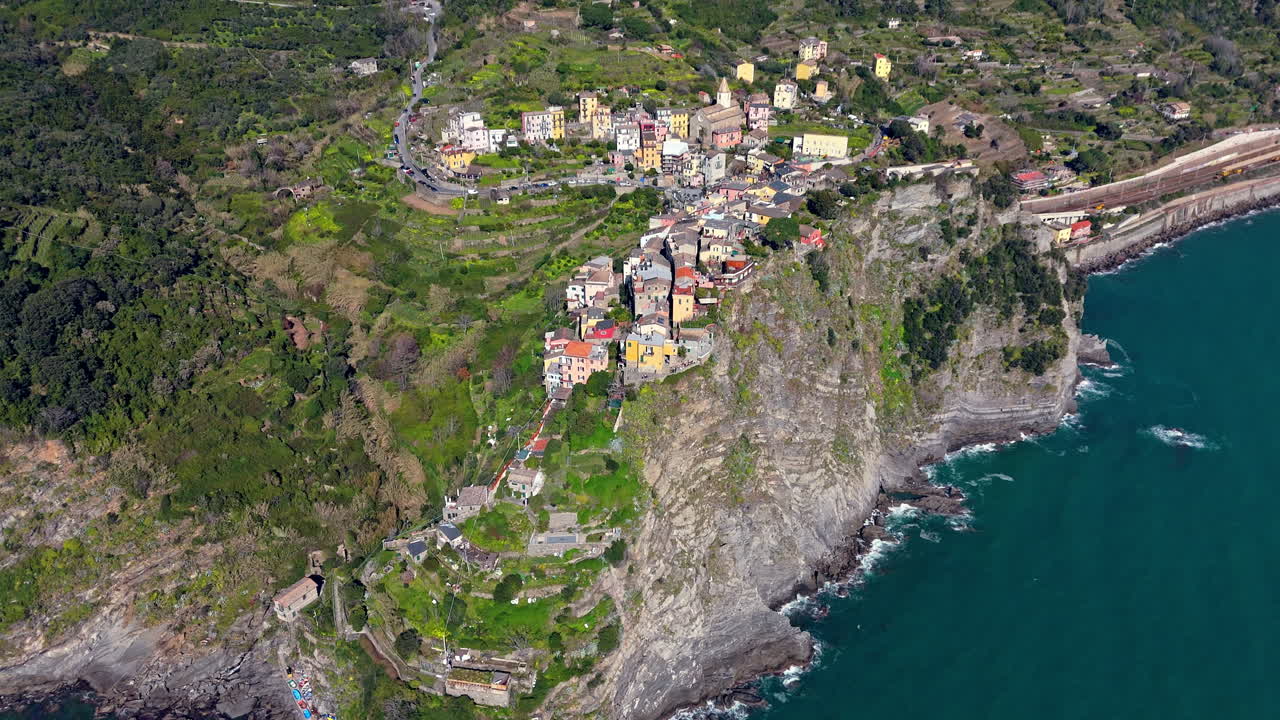 Corniglia village in cinque terre, italy, nestled on cliffs above the sea, aerial view