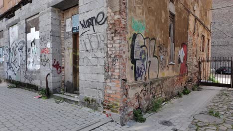 worn bricks, broken windows reflect urban decay and neglect in central riga zone