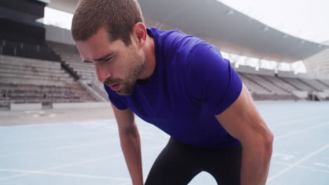 athlete resting on track